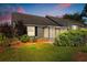 Charming home with a well-maintained exterior and screened-in patio with mature landscaping at 1126 Villa Ln # 91, Apopka, FL 32712