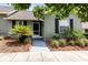 Charming single-story home featuring tidy landscaping, walkway, and a screened front entry at 1126 Villa Ln # 91, Apopka, FL 32712
