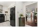 View of the kitchen leading to the living area, showcasing modern appliances and stylish decor at 1126 Villa Ln # 91, Apopka, FL 32712