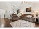 Cozy living room featuring vaulted ceilings, hardwood floors, and comfortable furnishings at 1126 Villa Ln # 91, Apopka, FL 32712