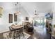 Open-concept living area with vaulted ceilings and access to the outdoor lanai at 1126 Villa Ln # 91, Apopka, FL 32712