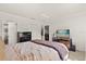 Comfortable main bedroom with a large bed, closet, and a view into the adjacent dining area at 1126 Villa Ln # 91, Apopka, FL 32712