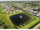 An aerial view of a residential community with a pond at 1171 Lebanon Ct, Sanford, FL 32771