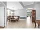 Elegant dining room with large table, arched doorway, and views of the backyard at 1171 Lebanon Ct, Sanford, FL 32771