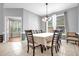 Inviting dining area with seating for eight and large windows providing ample natural light at 1171 Lebanon Ct, Sanford, FL 32771