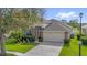 Attractive one-story home with stone details, lush landscaping, and spacious two car garage at 1171 Lebanon Ct, Sanford, FL 32771