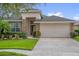 Charming single-Gathering home featuring stone accents and a well-manicured front lawn at 1171 Lebanon Ct, Sanford, FL 32771