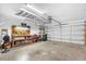 This well-organized garage features a workbench, overhead storage, and ample space for parking and projects at 1171 Lebanon Ct, Sanford, FL 32771