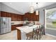 Modern kitchen boasts stainless steel appliances, granite countertops, and an island with seating at 1171 Lebanon Ct, Sanford, FL 32771