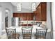 Beautiful kitchen featuring a center island with barstool seating and stylish pendant lighting at 1171 Lebanon Ct, Sanford, FL 32771