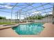 Sparkling pool with screened enclosure and attached hot tub, perfect for outdoor relaxation and entertaining at 1171 Lebanon Ct, Sanford, FL 32771
