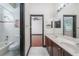 Bathroom featuring double sinks, generous counter space, and shower/tub combo at 140 Seville Chase Dr, Winter Springs, FL 32708