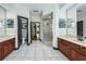 Large primary bathroom with separate sinks and shower stall at 140 Seville Chase Dr, Winter Springs, FL 32708
