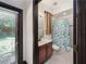 Bathroom featuring vanity with drawers, toilet, and shower with curtain at 140 Seville Chase Dr, Winter Springs, FL 32708