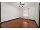 Bedroom with window, hardwood floors and ceiling fan at 140 Seville Chase Dr, Winter Springs, FL 32708