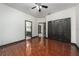 This spacious bedroom features wood floors, ceiling fan, and large closet for ample storage at 140 Seville Chase Dr, Winter Springs, FL 32708