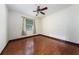 Bright bedroom with hardwood floors and a window providing natural light at 140 Seville Chase Dr, Winter Springs, FL 32708