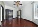Bedroom with rich hardwood floors and a closet at 140 Seville Chase Dr, Winter Springs, FL 32708