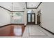 Bright foyer features tile and hardwood flooring, chandelier lighting, and decorative glass double entry doors at 140 Seville Chase Dr, Winter Springs, FL 32708