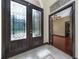 Foyer featuring tile floors, a decorative transom window, and a stained glass transom above the doorway at 140 Seville Chase Dr, Winter Springs, FL 32708