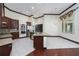 This kitchen offers a center island, stainless appliances, and an open floor plan at 140 Seville Chase Dr, Winter Springs, FL 32708