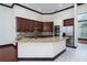 The kitchen includes granite counters, a large island, and stainless steel appliances at 140 Seville Chase Dr, Winter Springs, FL 32708