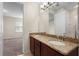 Bathroom with double vanity and granite countertop at 15208 Avenue Of The Arbors, Winter Garden, FL 34787