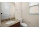 The bathroom features a granite countertop, white toilet, and a mirror at 15208 Avenue Of The Arbors, Winter Garden, FL 34787