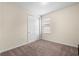 A bedroom with carpet flooring, a window, and closet at 15208 Avenue Of The Arbors, Winter Garden, FL 34787