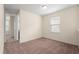 A bedroom with carpet flooring, a ceiling light, and a window at 15208 Avenue Of The Arbors, Winter Garden, FL 34787