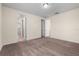 A bedroom with carpet flooring, a ceiling light, and two doors at 15208 Avenue Of The Arbors, Winter Garden, FL 34787