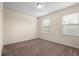 Bright bedroom with neutral walls and two windows at 15208 Avenue Of The Arbors, Winter Garden, FL 34787