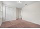 A cozy bedroom with plush carpet, closet and neutral walls at 15208 Avenue Of The Arbors, Winter Garden, FL 34787