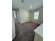 Cozy bedroom with soft carpeting, a bright window, and a peaceful atmosphere at 15208 Avenue Of The Arbors, Winter Garden, FL 34787