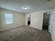 Spacious bedroom with ample natural light, neutral paint, and doorway to the Primary bathroom at 15208 Avenue Of The Arbors, Winter Garden, FL 34787