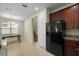 The open dining area has tile floors, a chandelier, and is connected to the kitchen at 15208 Avenue Of The Arbors, Winter Garden, FL 34787