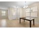 Bright dining room area with tile floors and ample natural light at 15208 Avenue Of The Arbors, Winter Garden, FL 34787
