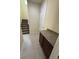 Inviting entryway featuring a granite countertop, tiled flooring, and convenient access to the stairs at 15208 Avenue Of The Arbors, Winter Garden, FL 34787