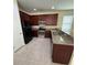 Well-equipped kitchen with stainless steel appliances, granite countertops, and ample cabinet space at 15208 Avenue Of The Arbors, Winter Garden, FL 34787