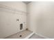 Laundry room featuring tile floors and overhead shelving at 15208 Avenue Of The Arbors, Winter Garden, FL 34787