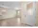 Bright, open living area with neutral walls, tiled flooring, and a front door with glass panels at 15208 Avenue Of The Arbors, Winter Garden, FL 34787