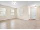 Living room featuring tile floors, natural light, and a neutral color scheme at 15208 Avenue Of The Arbors, Winter Garden, FL 34787