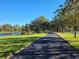 Scenic walking path lined with lush trees, creating a tranquil and inviting outdoor space at 15208 Avenue Of The Arbors, Winter Garden, FL 34787
