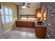 Bar area features a sink, granite countertops, and ample cabinet space at 1550 Kevin Ln, Deland, FL 32724