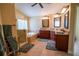 Luxurious bathroom with a soaking tub, glass-enclosed shower, and dual vanities at 1550 Kevin Ln, Deland, FL 32724