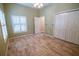Charming bedroom features large closet, decorative floor and ample natural light at 1550 Kevin Ln, Deland, FL 32724