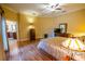 Warm and spacious bedroom with hardwood floors and en-suite bathroom access at 1550 Kevin Ln, Deland, FL 32724