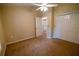 Comfortable bedroom with neutral carpet, double closets, and ample natural light at 1550 Kevin Ln, Deland, FL 32724