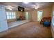 Versatile bonus room with wall mirror, ideal for a home gym, office, or recreation space at 1550 Kevin Ln, Deland, FL 32724