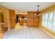 Spacious dining area with cabinetry and large window overlooking the front yard of the property at 1550 Kevin Ln, Deland, FL 32724
